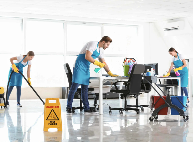 Professional commercial cleaning team cleaning office workspace and floors